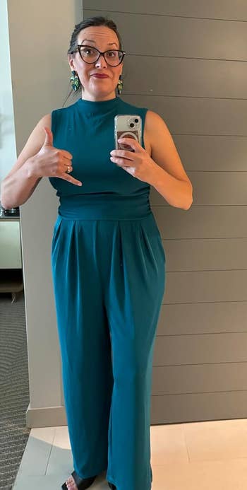 reviewer wearing the bluish jumpsuit
