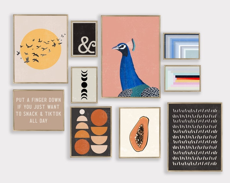 prints including small graphic and abstract designs, a peacock, a papaya, the sun with flying birds, and one that reads