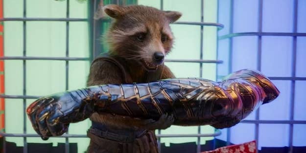 Rocket Raccoon from Guardians of the Galaxy holding a metallic cybernetic arm