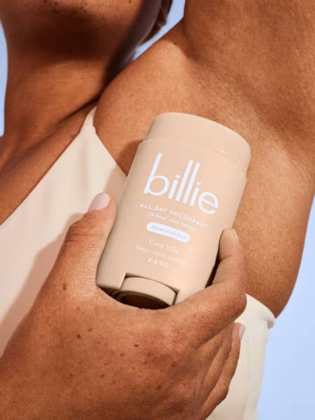 Person applying Billie deodorant instrumentality labeled