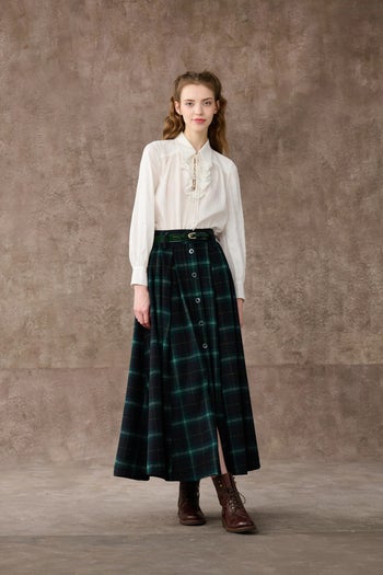same model wearing the skirt without holding it out to show how it looks when laying flat