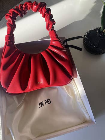 reviewer photo of the bag in red