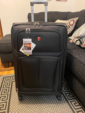 reviewer photo of black soft-side suitcase