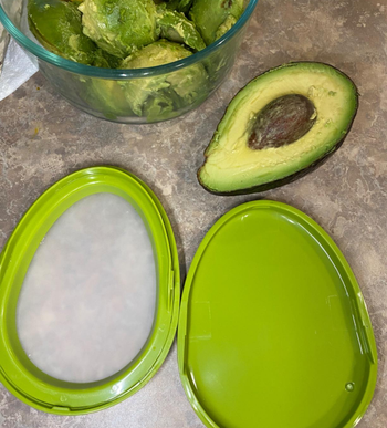a reviewer photo of the open avocado saver 