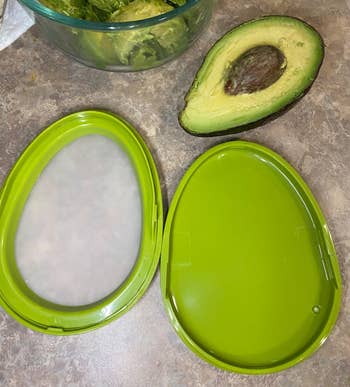 a reviewer photo of the open avocado saver 