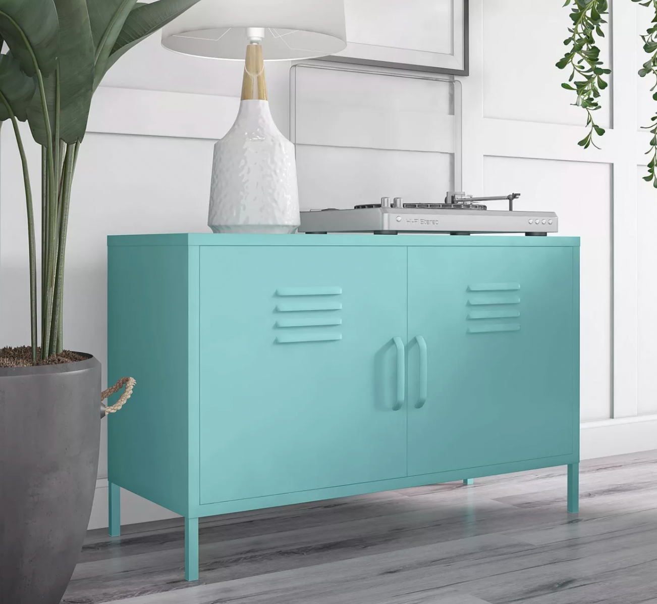 a turquoise locker-style cabinet with two doors