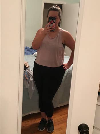 reviewer mirror selfie wearing pink workout tank