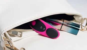 Pink and black panty vibrator inside purse