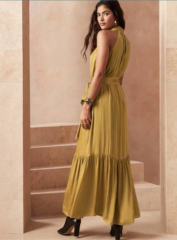 A model wearing the dress in yellow