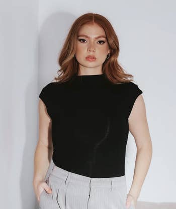 Model in a black version of the top 