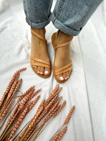 Model's feet in the tan sandals