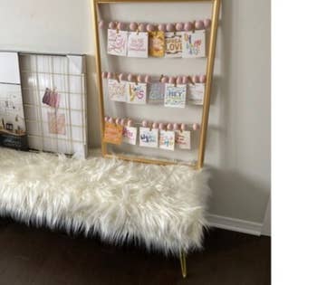reviewer photo of fuzzy bench in bedroom