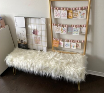 reviewer photo of fuzzy bench in bedroom