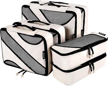 the set of six beige and mesh packing cubes