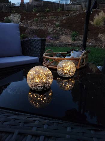 glowing orbs on a reviewer's outdoor table