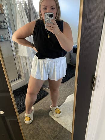 travel reviewer wearing the shorts in white