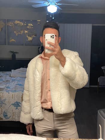 Reviewer wearing fur coat in white