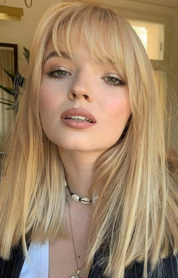 person wearing clip in bangs in blonde color