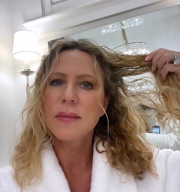 reviewer with wet, curly hair