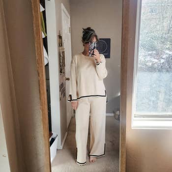 Woman in a mirror selfie wearing a loungewear set with trim detail