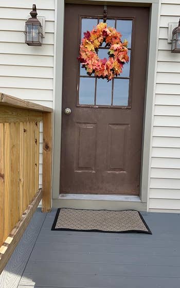 reviewer image of the doormat outside a door