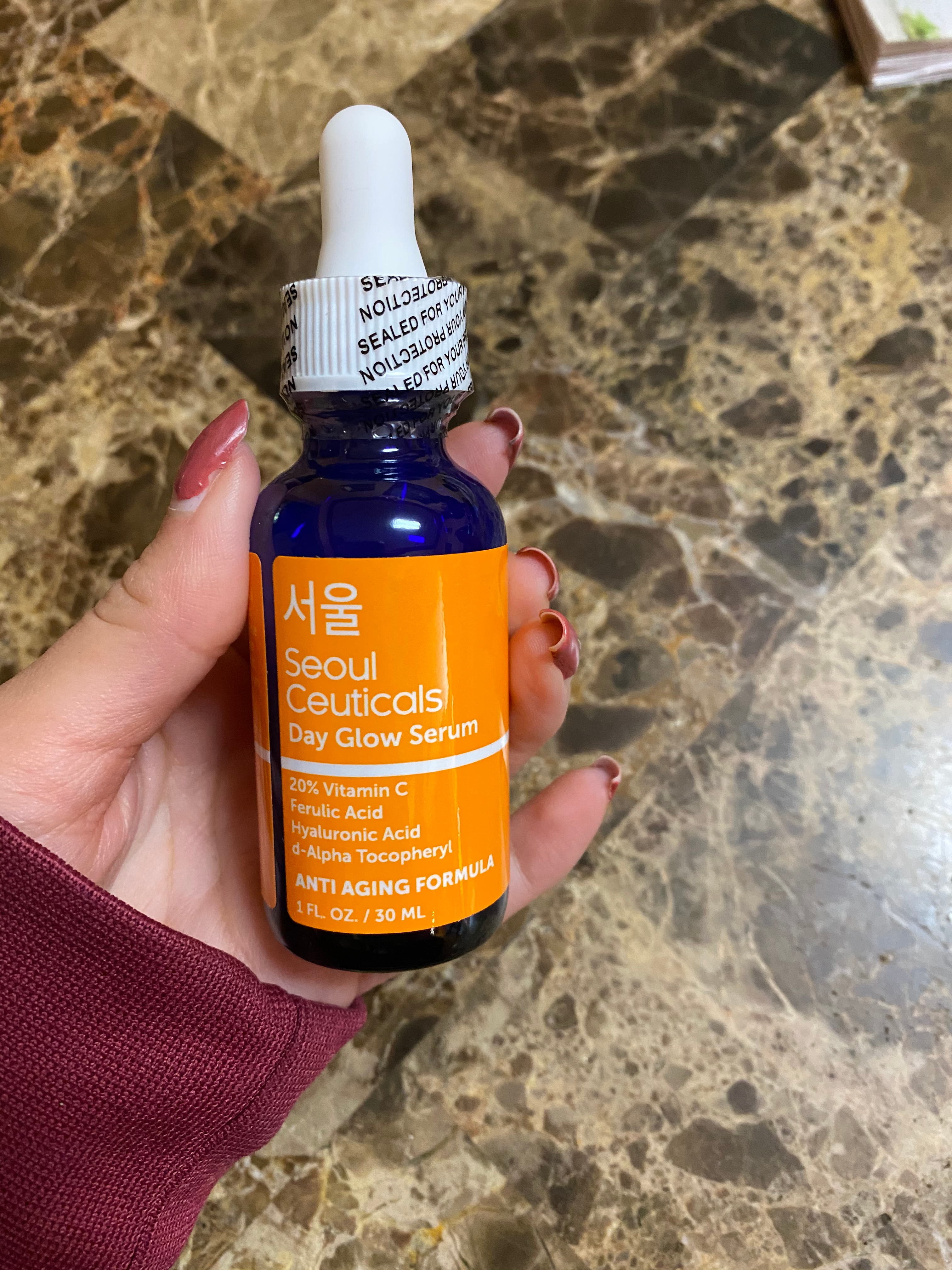 reviewer holding the vessel  of serum