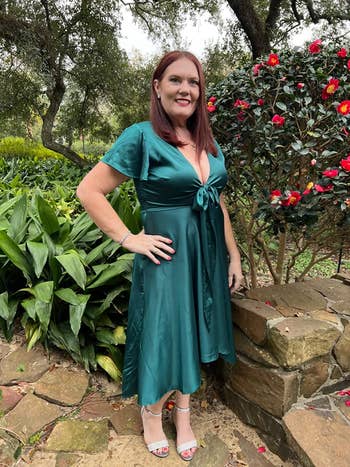 different reviewer wearing the dress in green