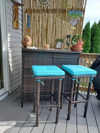 reviewer photo of the bar set with blue cushions