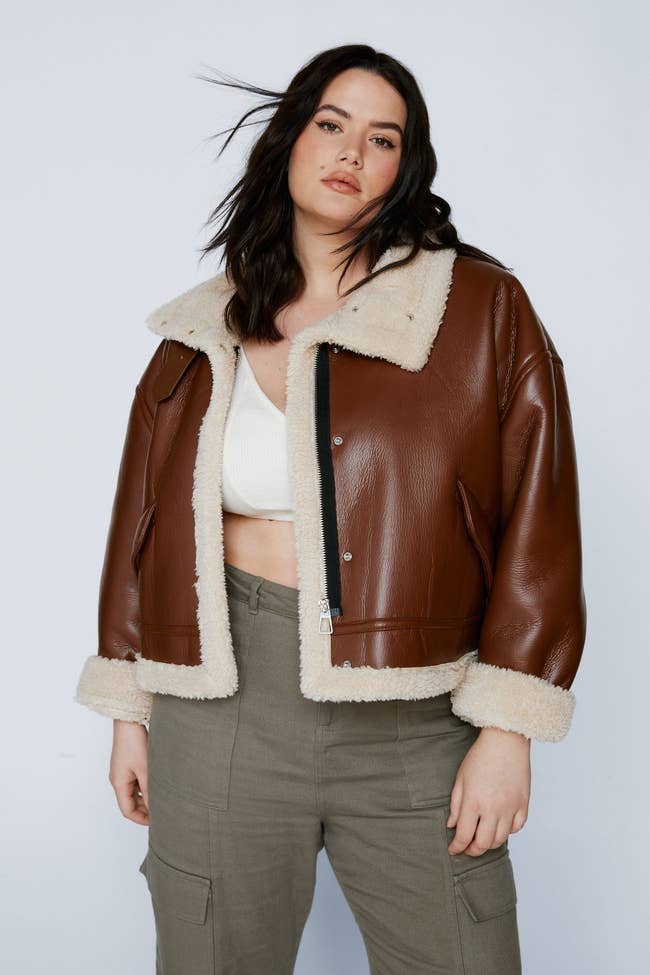 model wearing the brown aviator jacket