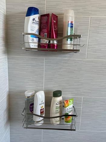 Silver shower caddy with various shampoo and conditioner bottles