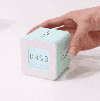 gif of someone rotating the teal cube timer, showing how it automatically switches to whichever timer it's turned to