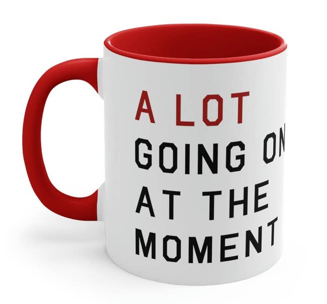 white, red, and black mug that reads 
