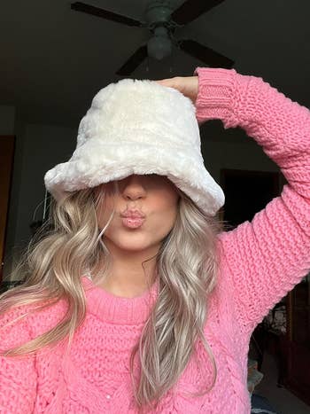 reviewer selfie wearing the chapeau successful white