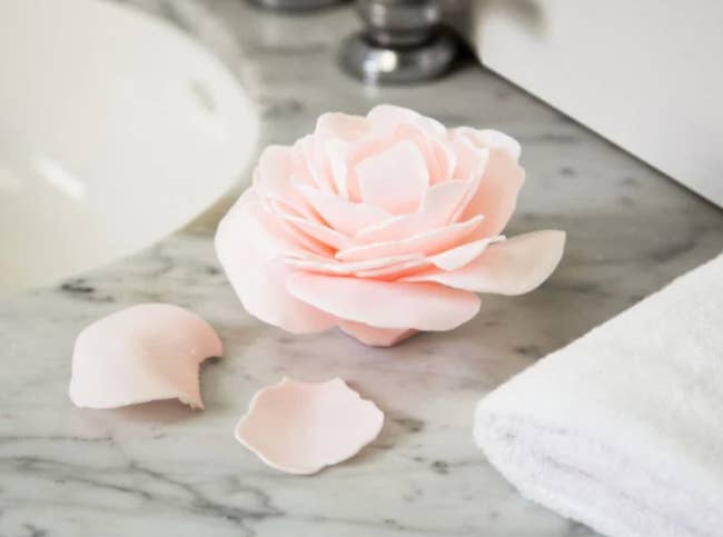 the rose petal bar of soap on a bathroom counter