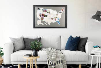 framed map of america with certain states filled with photos on living room wall 