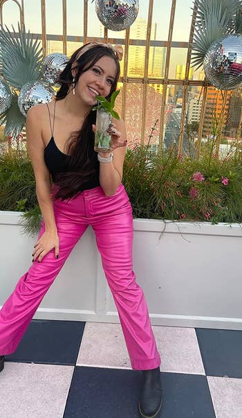 reviewer in the pink faux leather pants