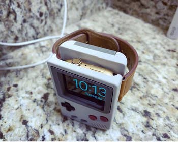 reviewer image of an apple watch resting in the apple watch stand