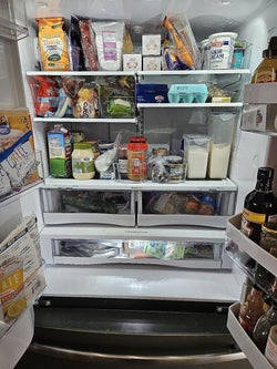 reviewers fridge organized with clear bins