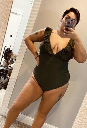 reviewer wearing ruffle v-neck swimsuit