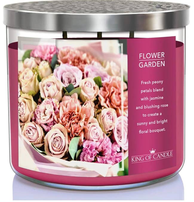 A scented candle with 'Flower Garden' label, featuring a mix of peony, jasmine, and rose scents