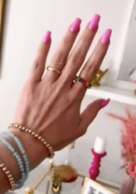 gif of reviewer with long pink nails showing the ring on their finger
