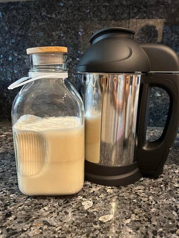 The machine next to a jug of cashe milk