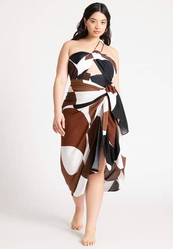 model in same skirt with brown and black print