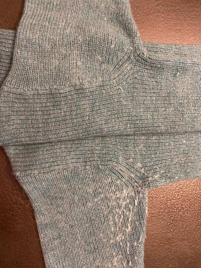 Close-up of airy  knit socks with disposable   deterioration  connected  the heels and soles, showing cloth  pilling and signs of use