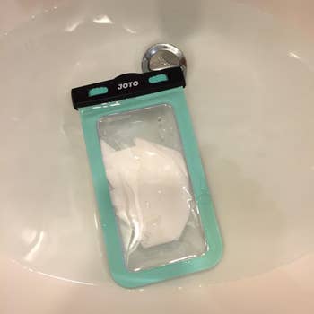 mint green case submerged in water showing the tissue inside is not wet