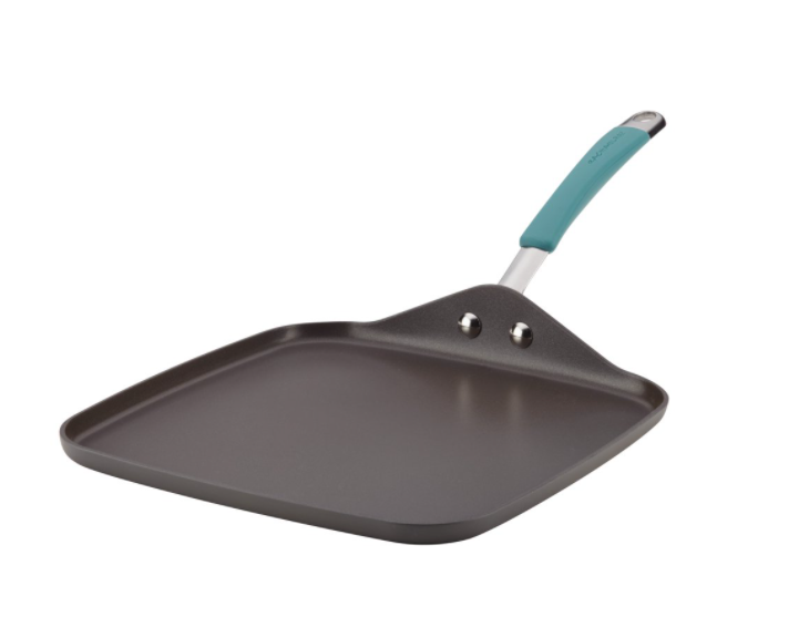 A flat griddle stick with a turquoise handle