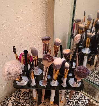 The makeup brush rack, with brushes upright for use