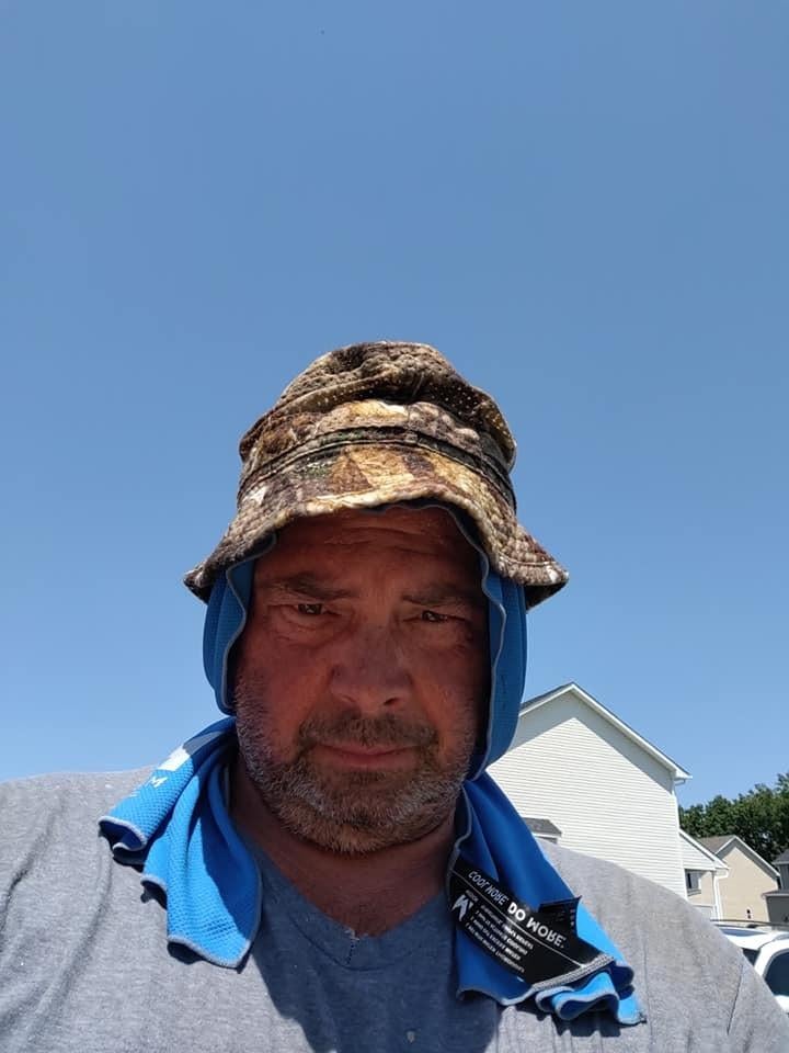 reviewer wearing the blue hoodie