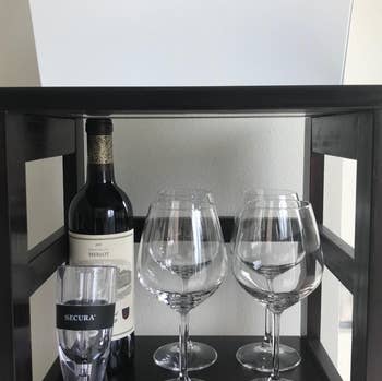 Reviewer image of the wine glasses on a shelf