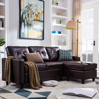 the brown leather sectional sofa with a chaise